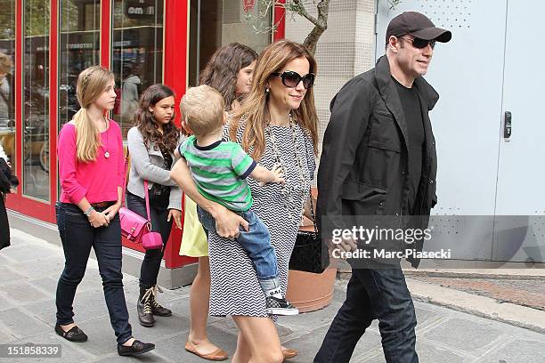 Actor John Travolta, his wife Kelly Preston, their son Benjamin and their daughter Ella Bleue are seen leaving the 'Pizza Pino' restaurant on...