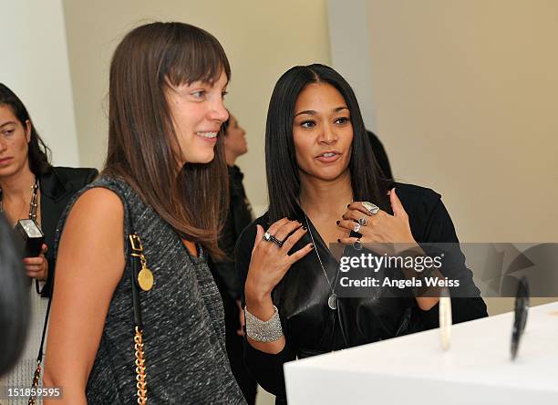 Esther Adams and designer Monique Pean attend the Monique Pean K'Atun Collection spring 2013 presentation during Mercedes-Benz Fashion Week on...