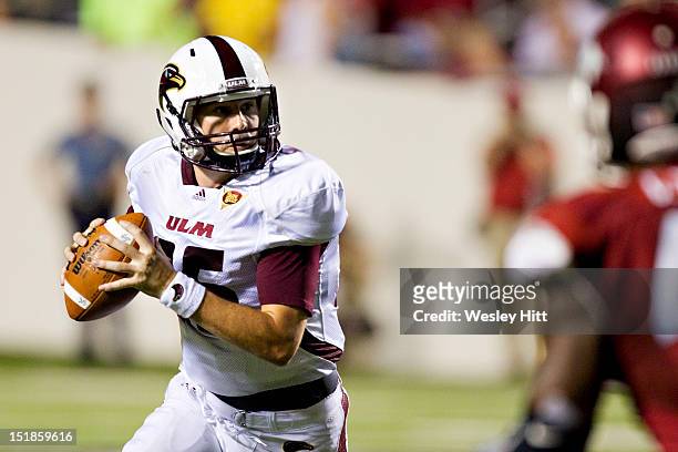 Kolton Browning of the Louisiana-Monroe Warhawks looks for a receiver during a game against the Arkansas Razorbacks at War Memorial Stadium on...