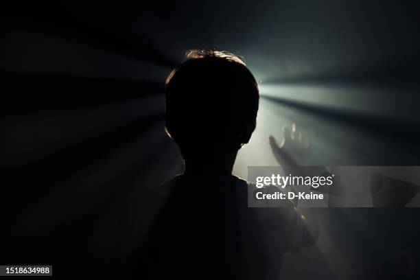 prayer - back lit stock pictures, royalty-free photos & images