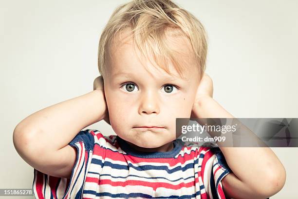 portrait of boy - covering ears stock pictures, royalty-free photos & images