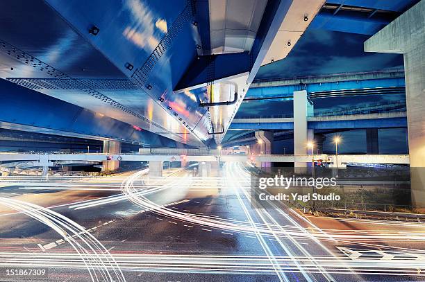 connection with dynamic fibre optic light trail - japan technology stock pictures, royalty-free photos & images