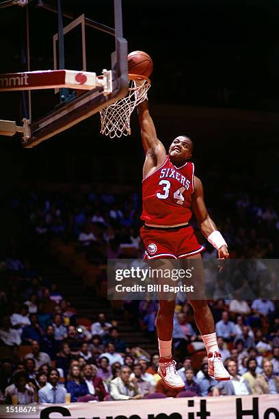 Charles Barkley of the Philadelphia 76ers drives in for a slam dunk against the Houston Rockets at the Summit in Houston, Texas. NOTE TO USER: User...