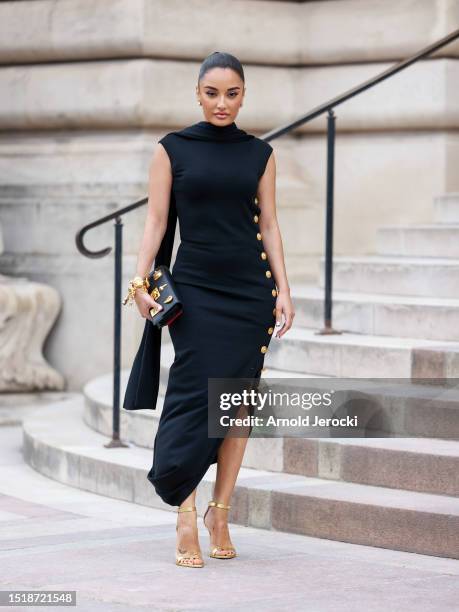 Amina Muaddi attends the Schiaparelli Haute couture Fall/Winter 2023/2024 show as part of Paris Fashion Week on July 03, 2023 in Paris, France.