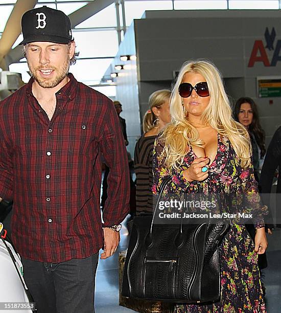 Eric Johnson and Jessica Simpson depart JFK Airport on September 11, 2012 in New York City.