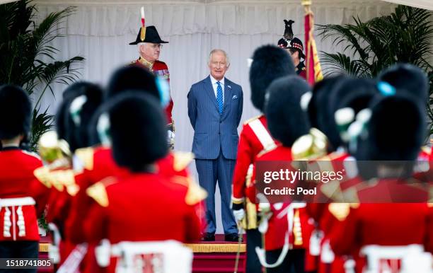 King Charles III waits to receive the President of the United States Joe Biden at the dais in the Quadrangle before inspecting the Guard of Honour at...