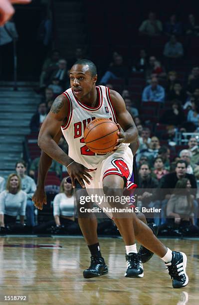 Jay Williams of the Chicago Bulls dribbles the ball during the NBA preseason game against the Toronto Raptors on October 11, 2002 at the United...