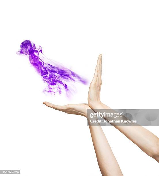 hands around purple liquid - hands catching stock pictures, royalty-free photos & images