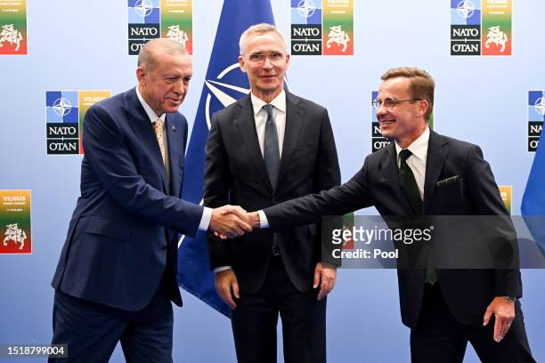 Turkish President Recep Tayyip Erdogan, Secretary General of NATO Jens Stoltenberg and Swedish Prime Minister Ulf Kristersson pose for a photograph...