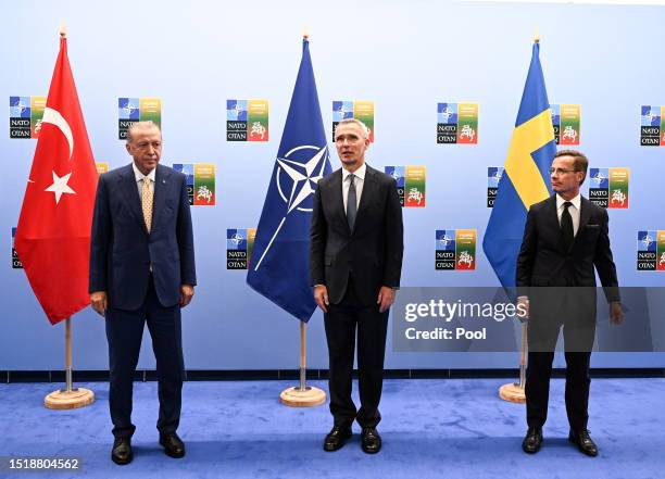 Turkish President Recep Tayyip Erdogan, Secretary General of NATO Jens Stoltenberg and Swedish Prime Minister Ulf Kristersson pose for a photograph...