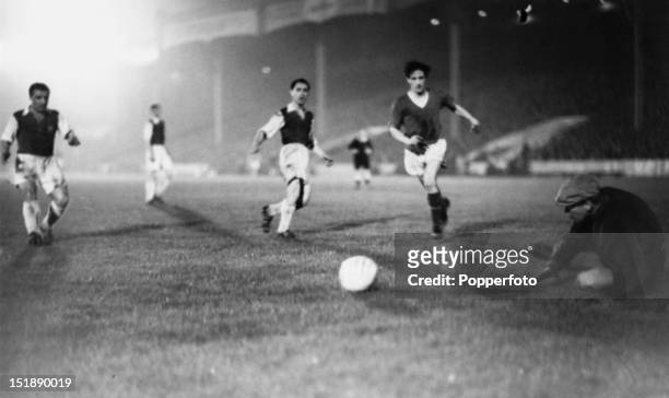 Manchester United inside forward Dennis Viollet scores his fourth goal against Anderlecht during the European Champions Cup Preliminary Round second...