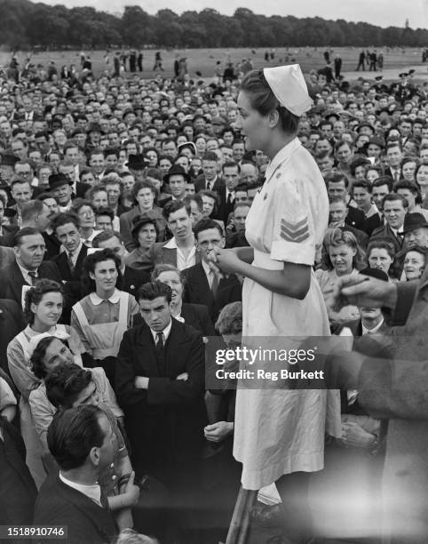 Crowd of people gather in London's Hyde Park to listen to third year student nurse, Joan Syms, during a protest organised by the Confederation of...