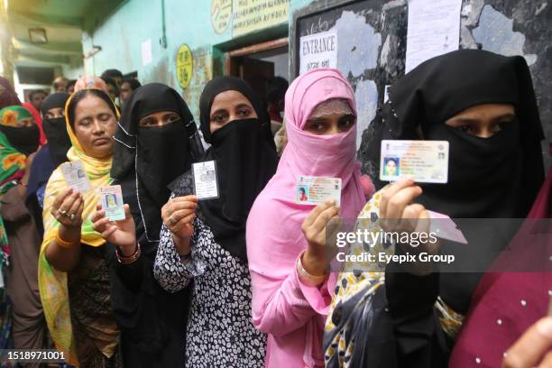 July 08 Howrah,India: People queue at a polling station to cast their vote in West Bengal's 'Panchayat' or local elections, on the outskirts of...