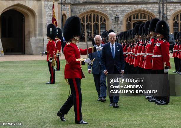 President Joe Biden and Britain's King Charles III inspect the Guard of Honour formed by the Welsh Guards, during a ceremonial welcome in the...