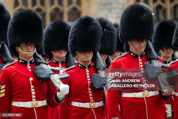 Members of the Welsh Guards march during a ceremonial welcome for US President Joe Biden in the Quadrangle at Windsor Castle in Windsor on July 10,...