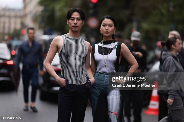 Guests seen outside Jean Paul Gaultier show wearing Jean Paul Gaultier tops and pants with body prints with black Rick Owens heels and shiny brown...