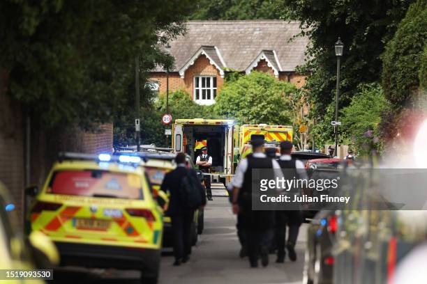 Police and emergency services attend the scene of a car crash at a school on July 6, 2023 in Wimbledon, England. A Land Rover has reportedly crashed...
