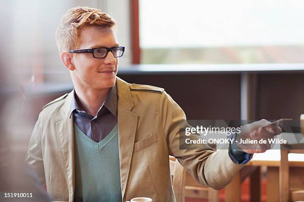 man paying bill by credit card in a restaurant - restaurant bill ストックフォトと画像