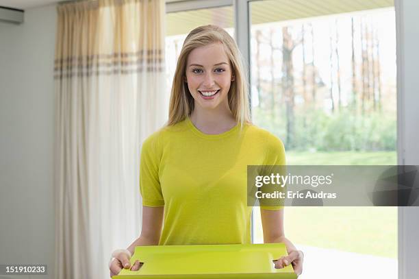 happy woman carrying an empty tray - tray stock-fotos und bilder