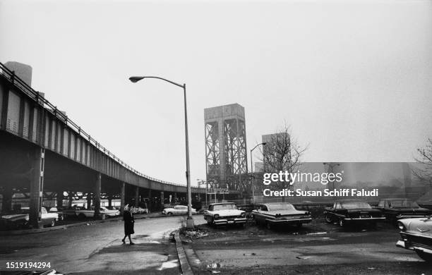 Railroad bridge and parking lots at the end of Park Avenue in the Fordham Manor neighbourhood of The Bronx in New York City, New York, circa 1965.