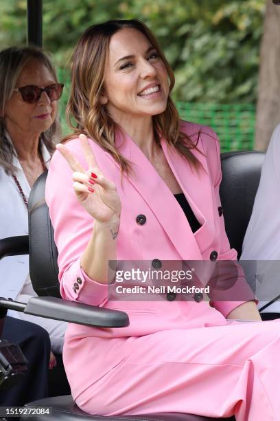 Mel C arrives in a golf buggy as she attends day four of the Wimbledon Tennis Championships at All England Lawn Tennis and Croquet Club at All...
