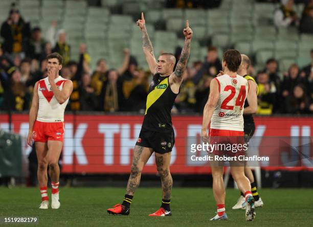 Dustin Martin of the Tigers celebrates on the siren after the Tigers defeated the Swans during the round 17 AFL match between Richmond Tigers and...