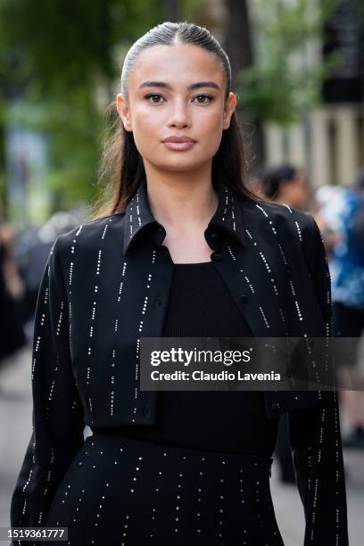 Kelsey Merritt wears a black cropped jacket with crystals details and matching mini skirt, outside Viktor & Rolf, during the Haute Couture...