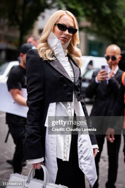 Christine Quinn wears a white ruffle shirt, black cropped blazer, black sunglasses and white bag, outside Viktor & Rolf, during the Haute Couture...