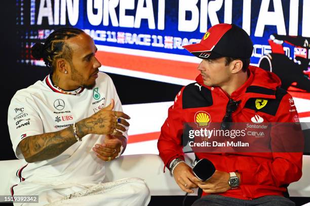 Lewis Hamilton of Great Britain and Mercedes and Charles Leclerc of Monaco and Ferrari talk in the Drivers Press Conference during previews ahead of...