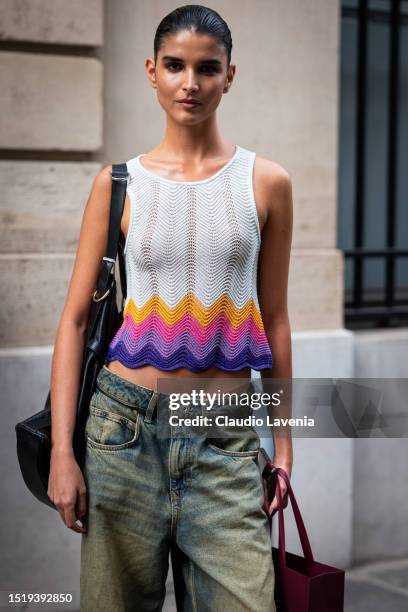 Paula Soares wears a colorful knitted top, black bag and green jeans, outside Zuhair Murad, during the Haute Couture Fall/Winter 2023/2024 as part of...