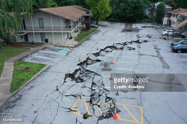 An aerial view shows damage to a parking lot after historic rainfall north of New York City triggered dozens of water rescues and led to roadways...