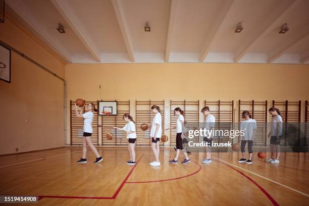 high school students during basketball training - physical education stock pictures, royalty-free photos & images