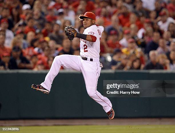 Erick Aybar of the Los Angeles Angels fields a groundball off the bat of Jonny Gomes of the Oakland Athletics during the seventh inning at Angel...