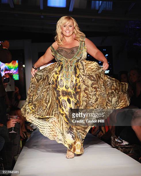 Australian television personality Ajay Rochester walks the runway during the "Real Fashion, Real Women" Runway Show Benefiting Bottomless Closetat...