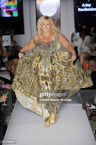 Australian television personality Ajay Rochester walks the runway during the Derek Warburton "Real Fashion, Real Women" Benefit during Spring 2013...