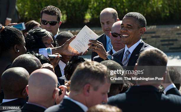 President Barack Obama lingered to chat with family members and survivors and sign invitations following a attend a private ceremony on the 11th...