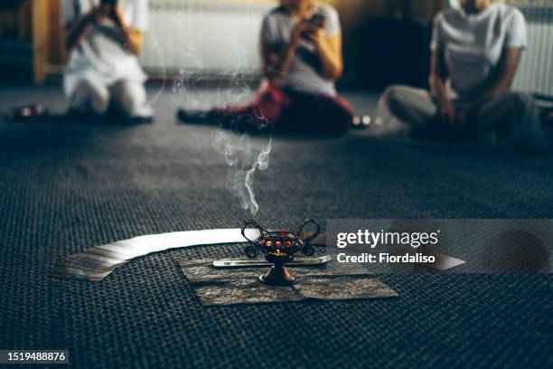 incense, perfumed burning sticks, candle. ritual attributes of a mystical spiritual seance - chakras stock pictures, royalty-free photos & images