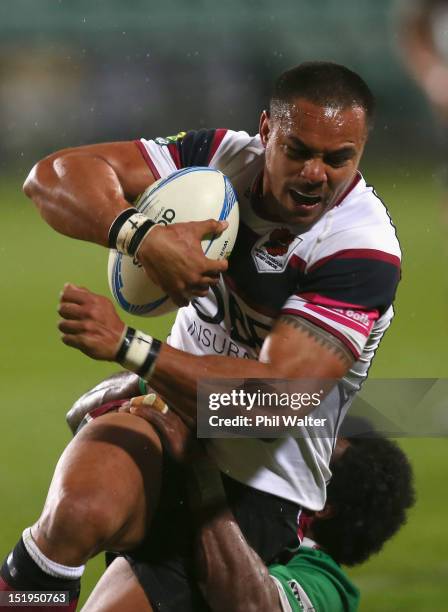 Rudi Wulf of North Harbour is tackled during the round seven ITM Cup match between North Harbour and Manawatu at North Harbour Stadium on September...