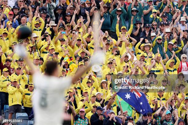 Australian fans celebrate after Mitchell Marsh of Australia reaches his century during Day One of the LV= Insurance Ashes 3rd Test Match between...