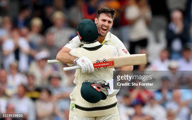 Mitchell Marsh of Australia celebrates with Travis Head after reaching his century during Day One of the LV= Insurance Ashes 3rd Test Match between...