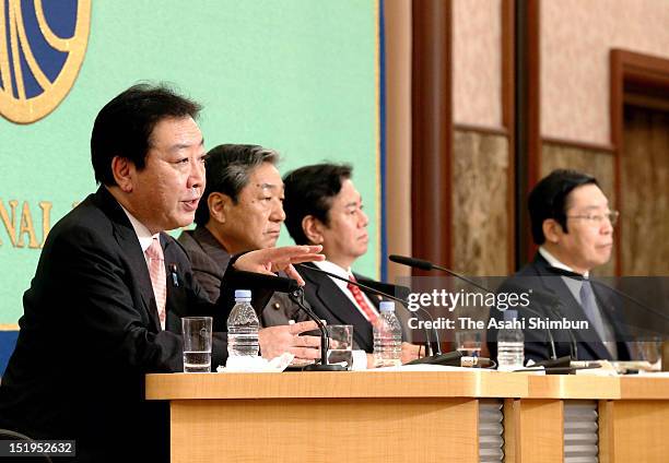 Japanese Prime Minister and the leader of the Democratic Party of Japan Yoshihiko Noda speaks while other DPJ presidential election candidates...