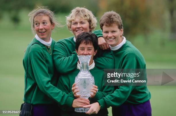 Kitrina Douglas, Laura Davies, Alison Nicholas, and Trish Johnson of the European team hold the trophy after Europe defeated the United States in the...