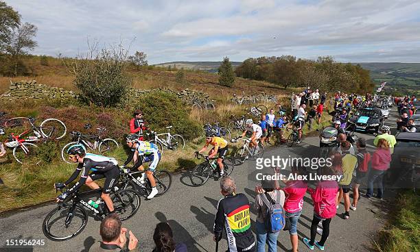 Bradley Wiggins of Sky Pro Cycling is followed by Leigh Howard of Orica - GreenEDGE and Mark Cavendish of Sky Pro Cycling as they climb Gun Hill in...