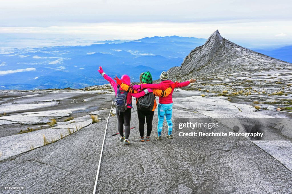 Happy climbers on Mount Kinabalu on a sunny morning
