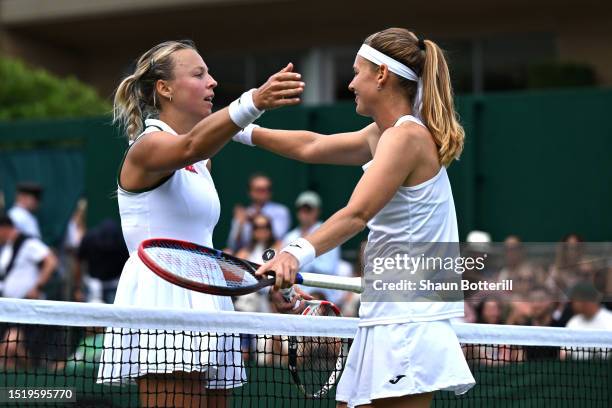Anett Kontaveit of Estonia and Marie Bouzkova of Czech Republic embrace following the Women's Singles second round match during day four of The...