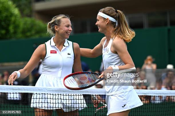 Anett Kontaveit of Estonia and Marie Bouzkova of Czech Republic embrace following the Women's Singles second round match during day four of The...