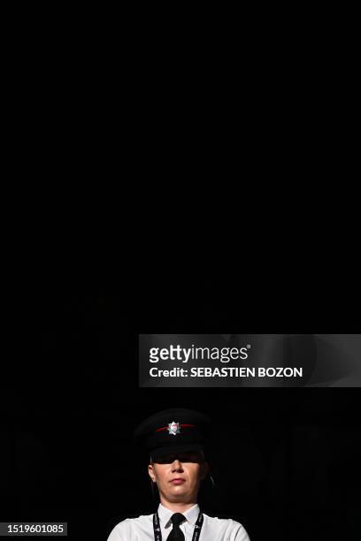 Security member stands guard at the entrance of cour 1 during the men's singles tennis match between Bulgaria's Grigor Dimitrov and Denmark's Holger...