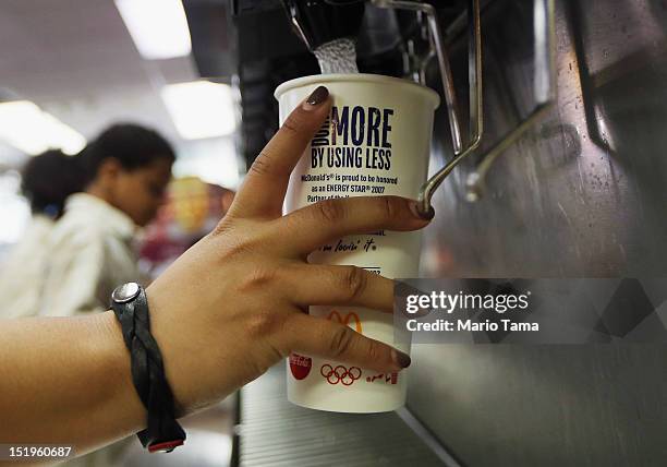 Customer fills a 21 ounce cup with soda at a 'McDonalds' on September 13, 2012 in New York City. In an effort to combat obesity, the New York City...