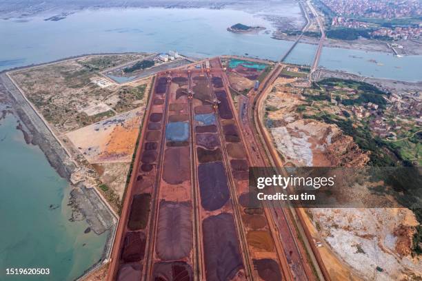 aerial view of metal raw materials stacked at the freight terminal - ship on fire stock pictures, royalty-free photos & images