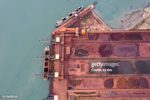 aerial view of metal raw materials stacked at the freight terminal - ship on fire stock pictures, royalty-free photos & images